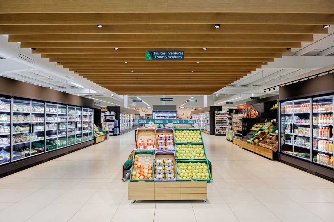 a-well-lit-grocery-store-aisle-with-produce-displays-2vgvrwpwkye